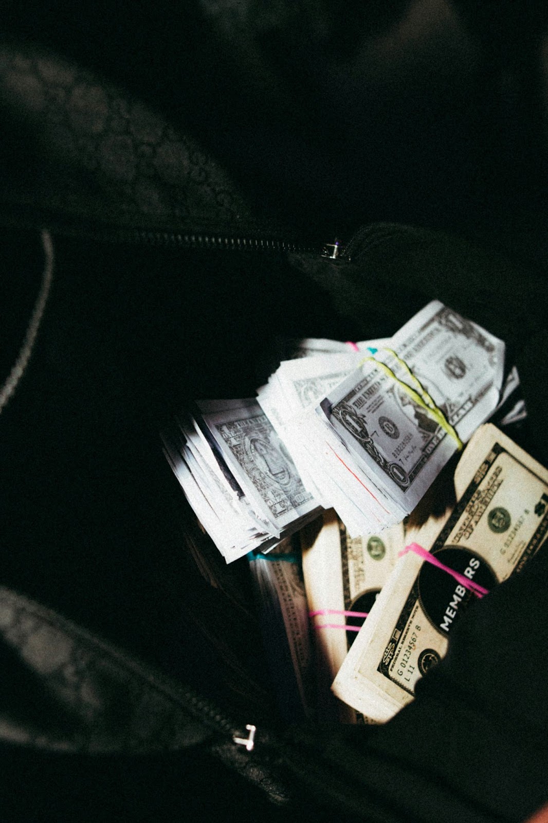 Dollar notes in a bag