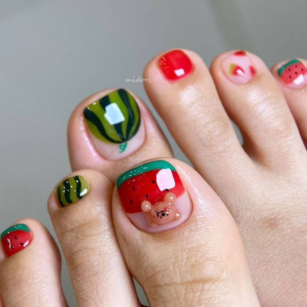 Close up of foot with radiant toe nail having Watermelon Theme toenails