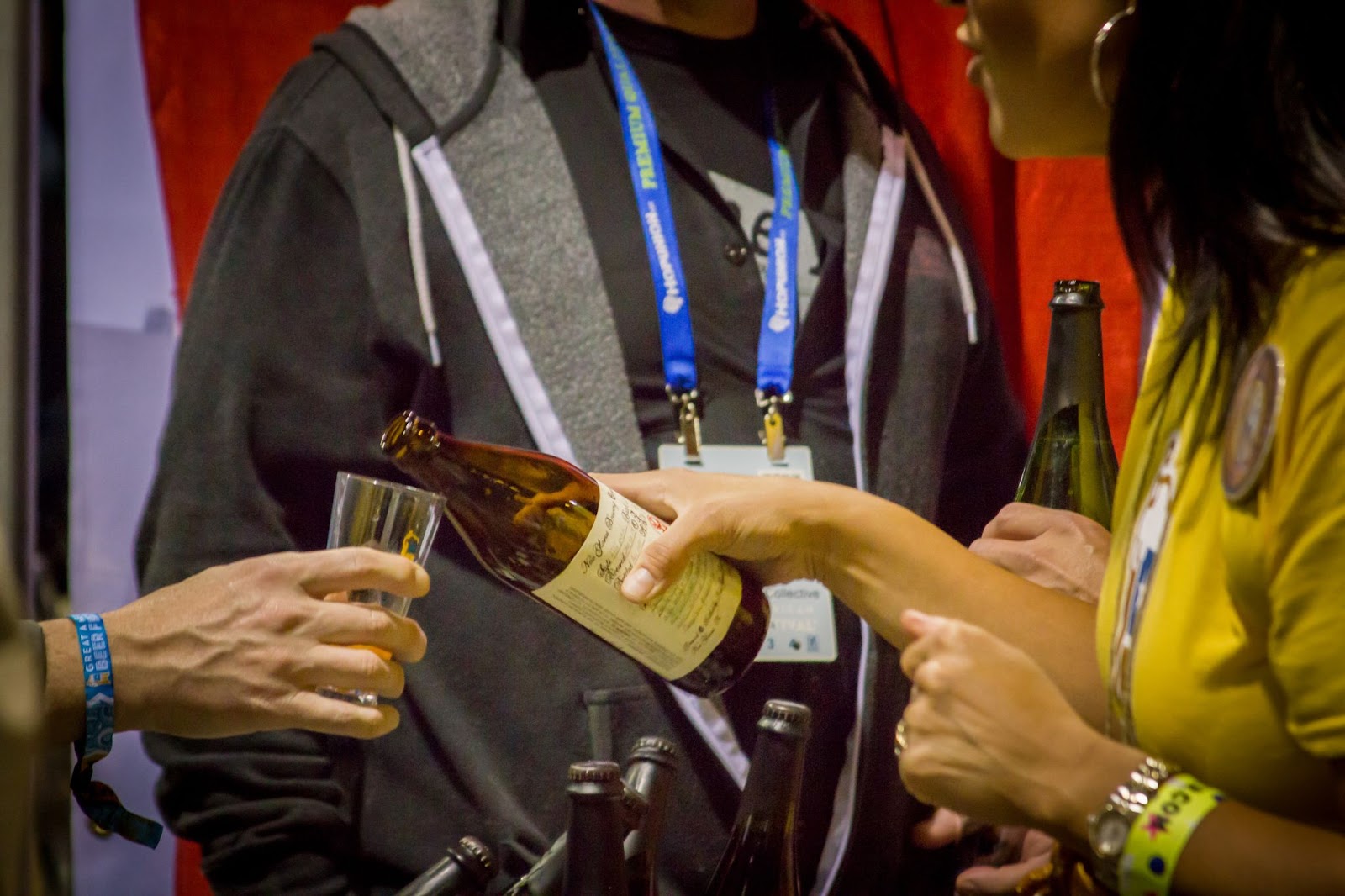 person pouring beer at the Great American Beer Festival in Denver