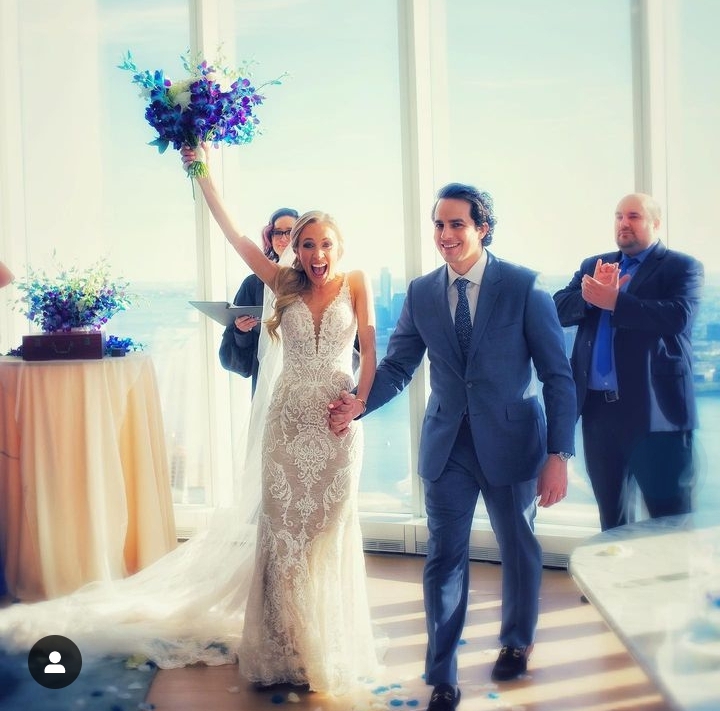 Cameron Friscia and Kat Timpf on their wedding day