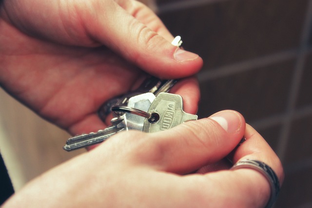 Person holding keys in hand