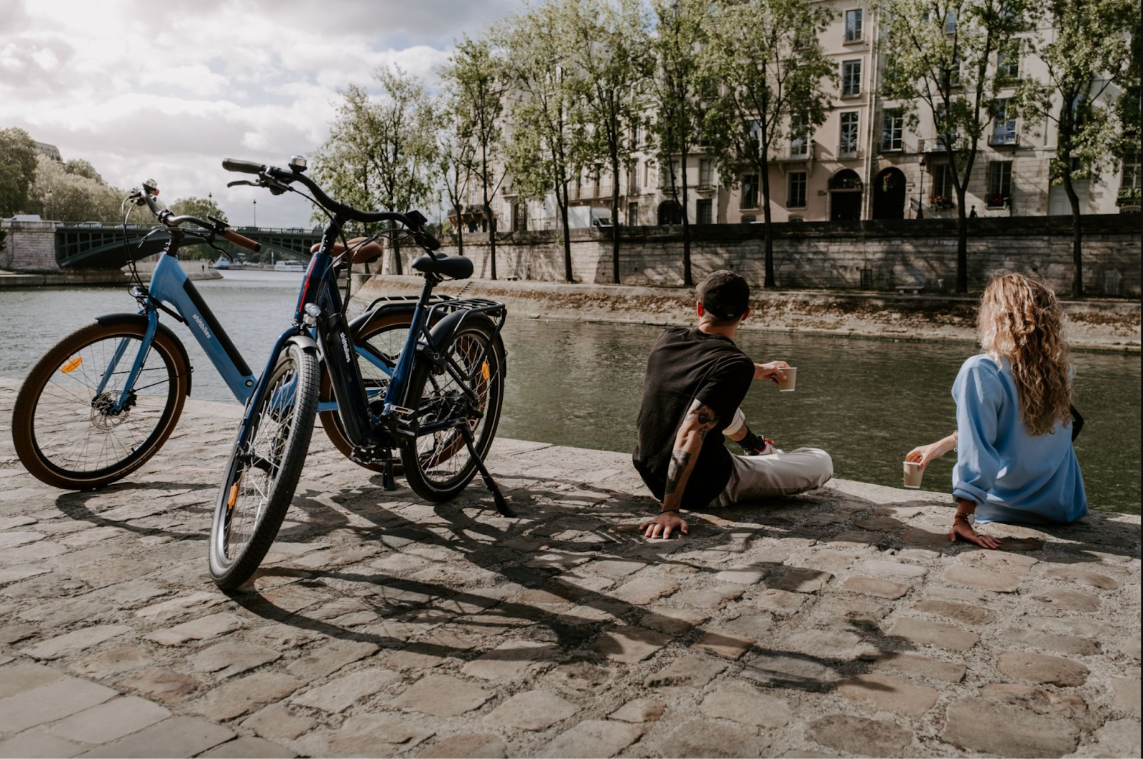 Two friends take a break during their bike tour of Paris