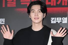 A picture of BTS members Suga
