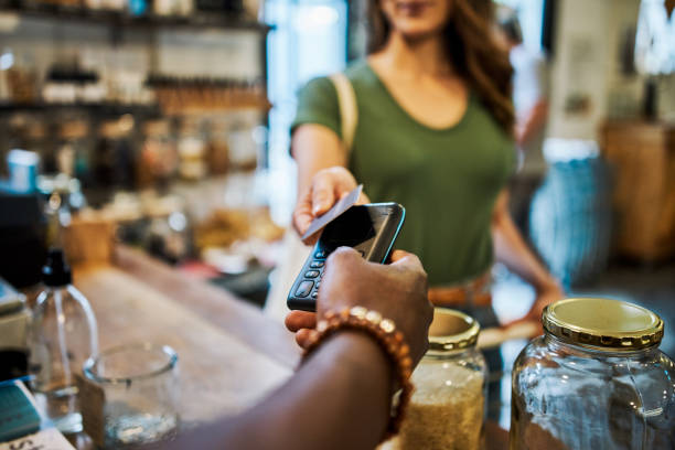 Costumer paying at the cashier using credit card