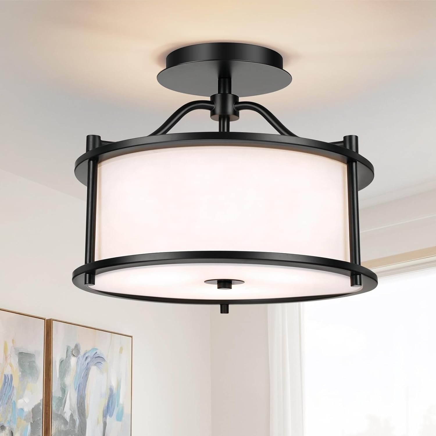 A semi-flush mount ceiling light with a round frosted shade, encased in a black metal frame.