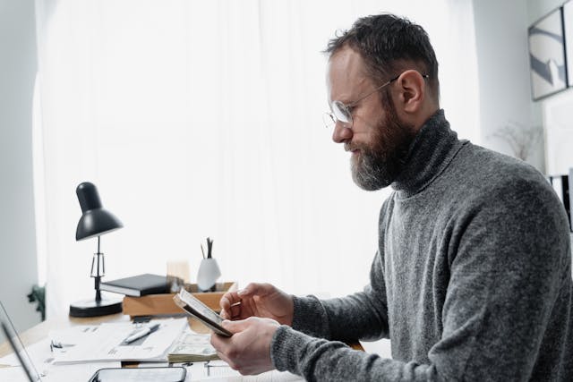 investor counting money and assets