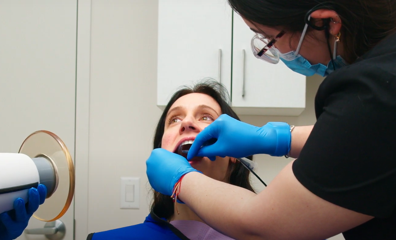 A doctor performs surgery on a patient, using precision and care to address the medical issue at hand.