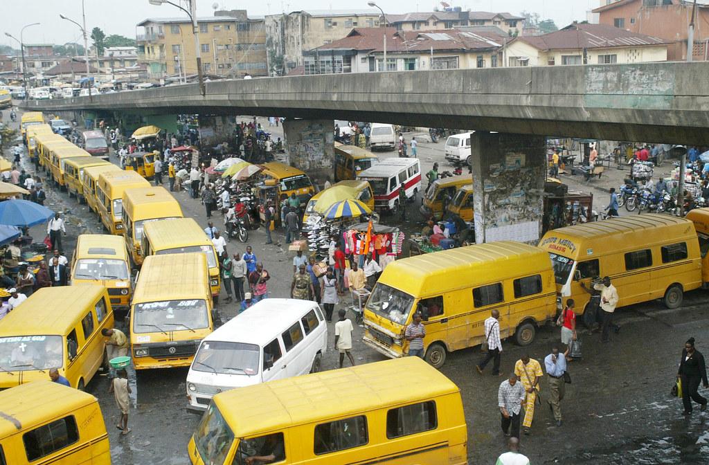 NIGERIA OBALENDE BUS STOP | Passengers walk among commercial… | Flickr