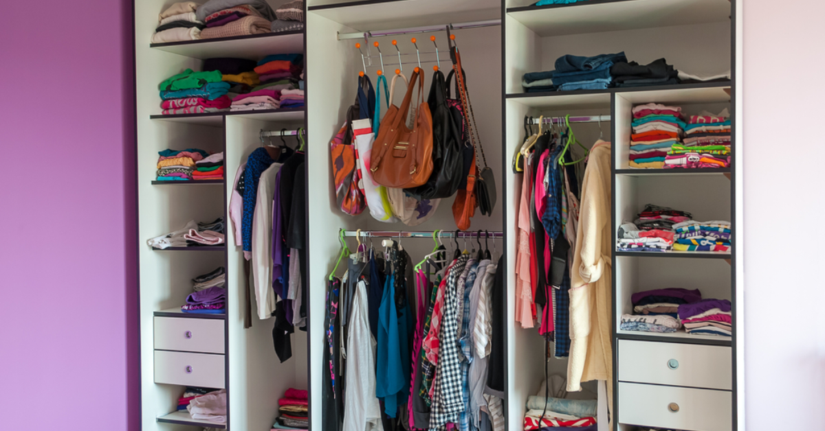 A closet filled with various clothes and bags, inviting the question: What accessories dominate your wardrobe?