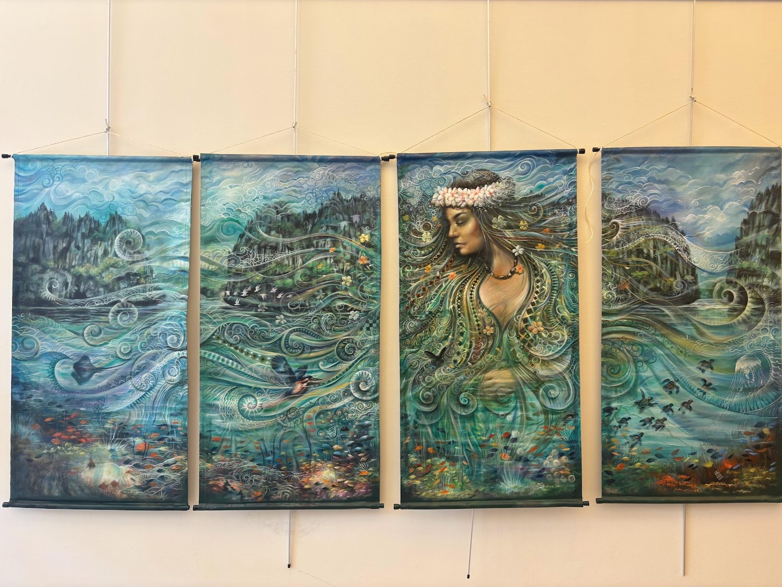 A group of paintings on a wallAI-generated content may be incorrect.