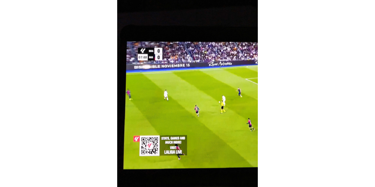 La Liga QR Code displayed on a football match telecasted on a TV.