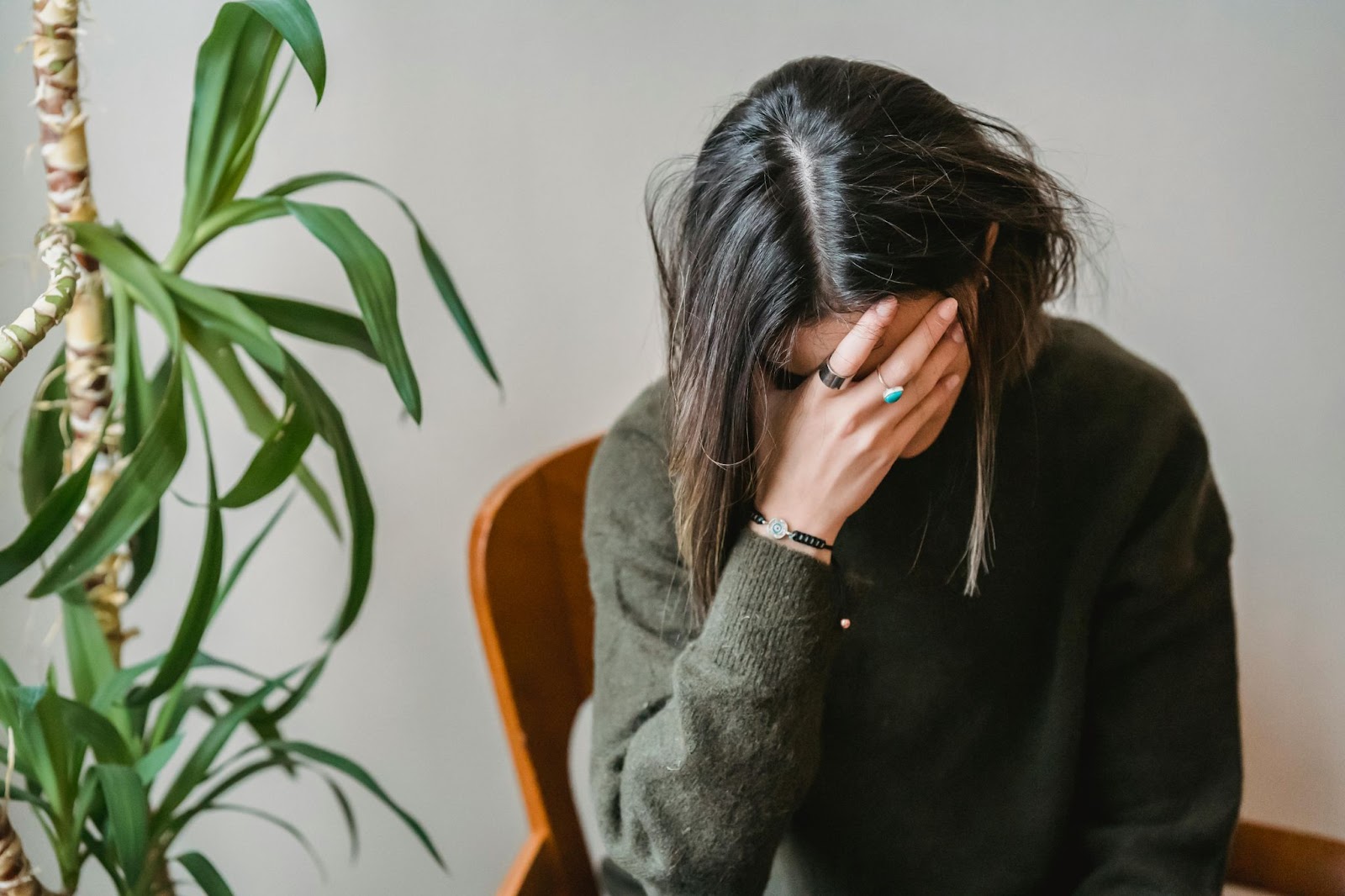 A stressed woman holding her face