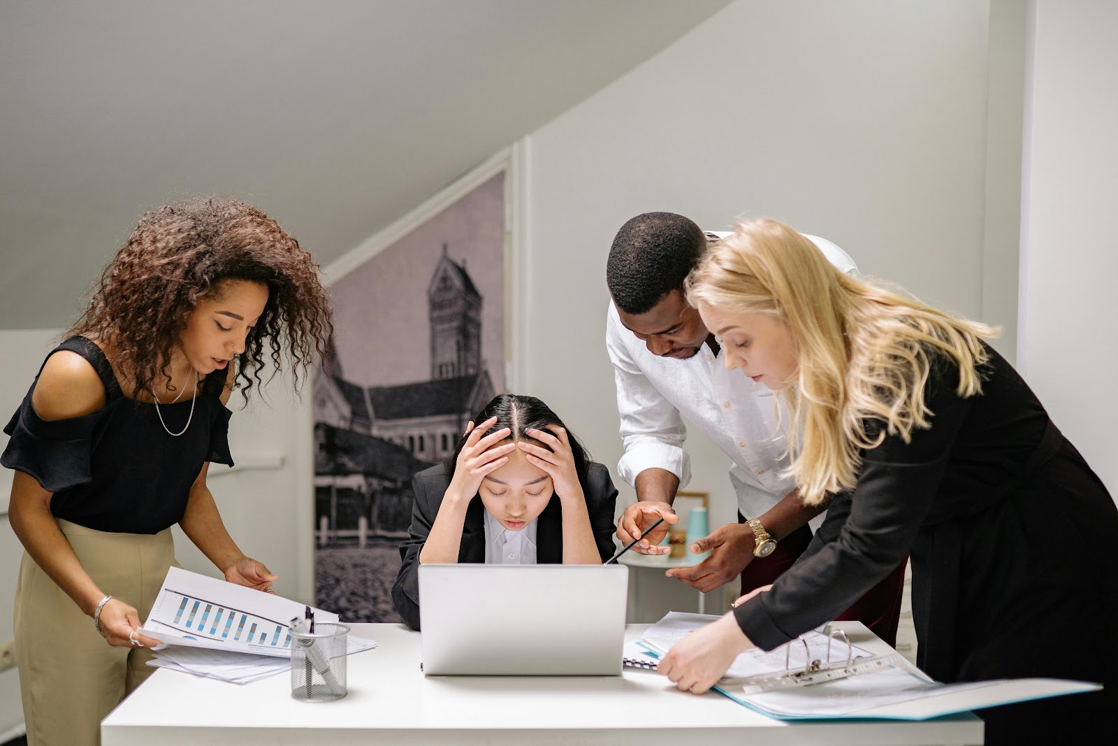 A woman being stressed out by several people surrounding her | Source: Pexels