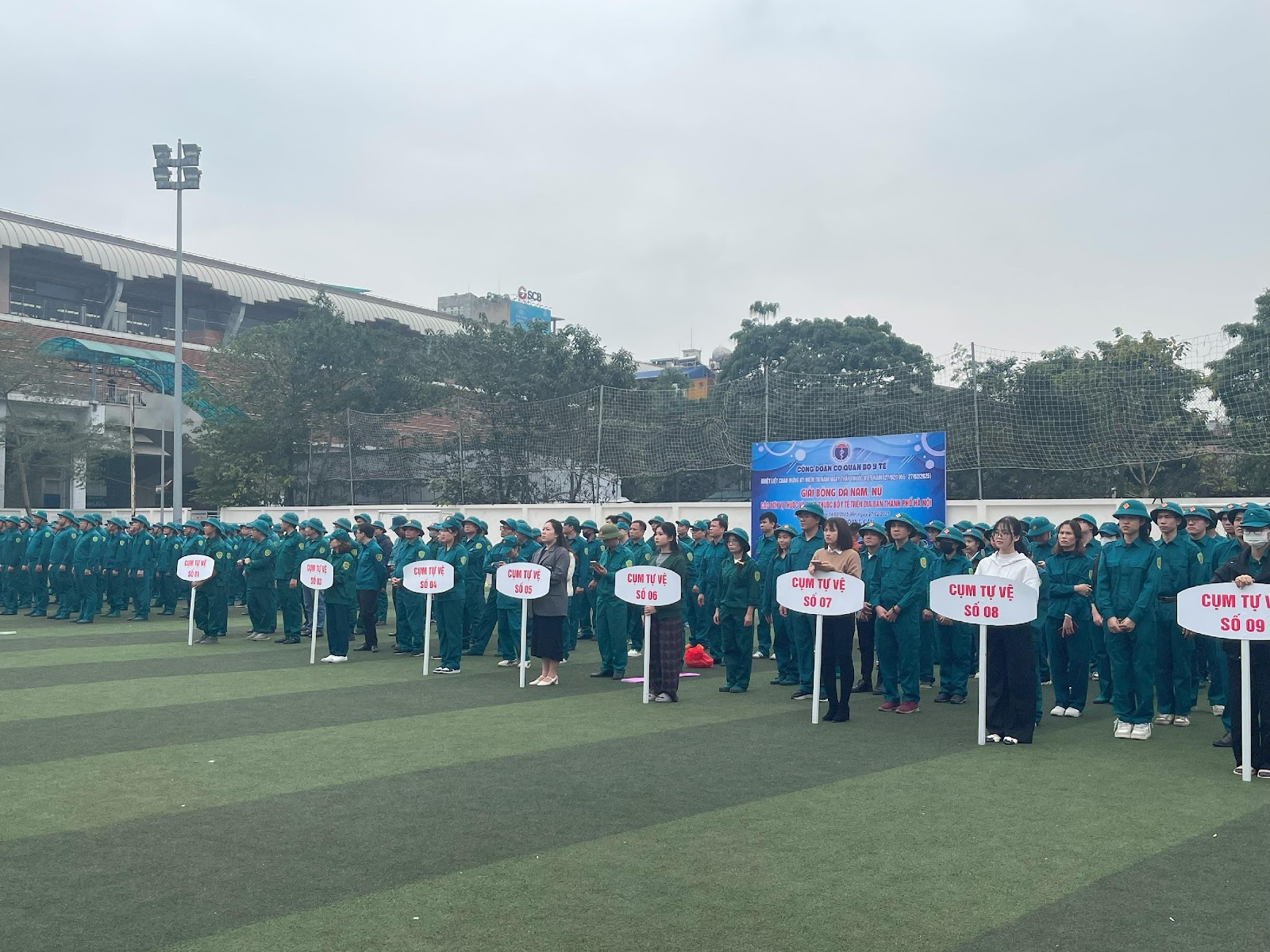 A group of people in uniform holding signs

AI-generated content may be incorrect.