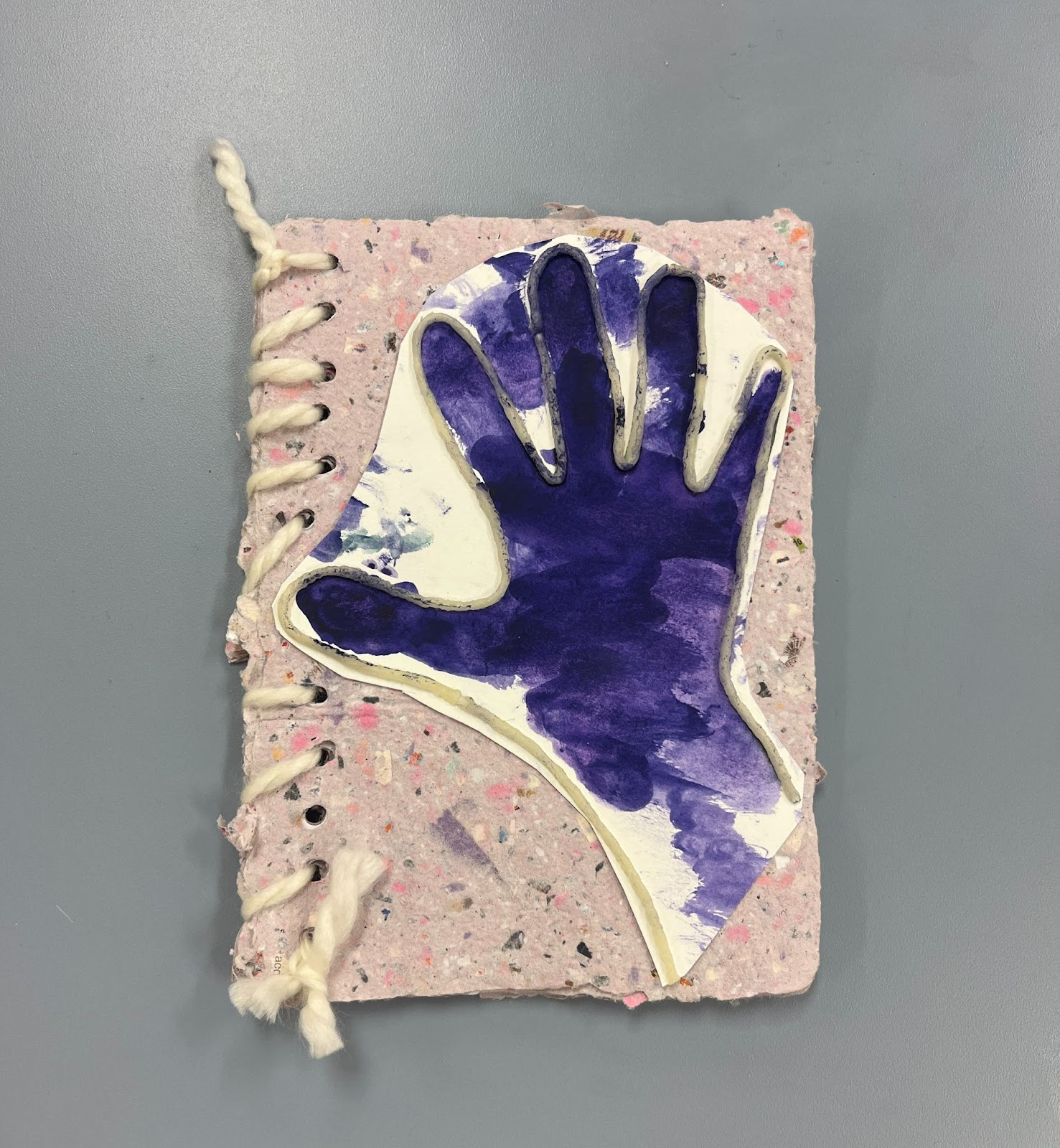 Tactile hand print on handmade paper