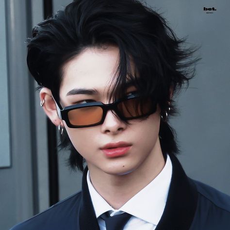 This may contains an image of ENHYPEN's Ni-Ki  with black hair and sunglasses 