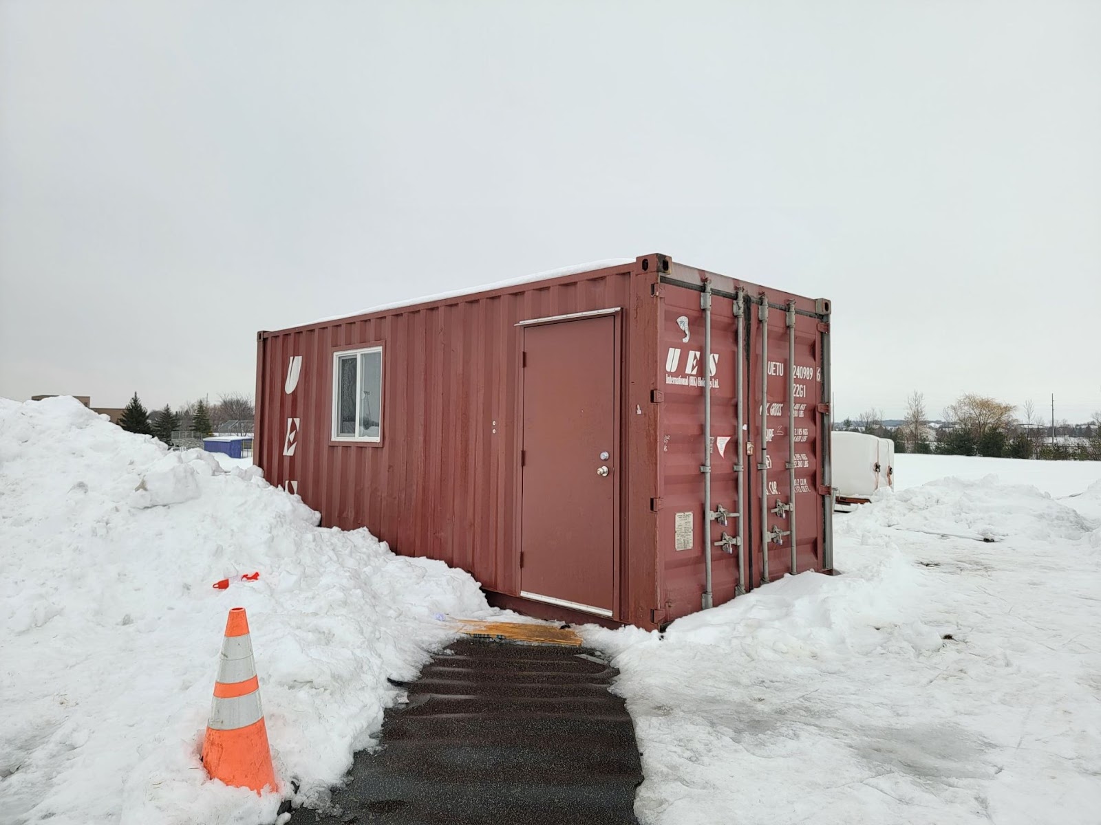 shipping container modified into ice hockey warming house