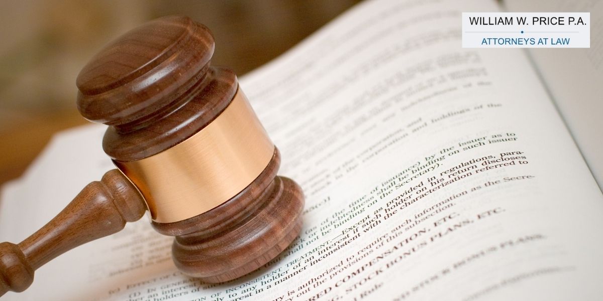 a gavel on a law book with the William Price logo in the corner.