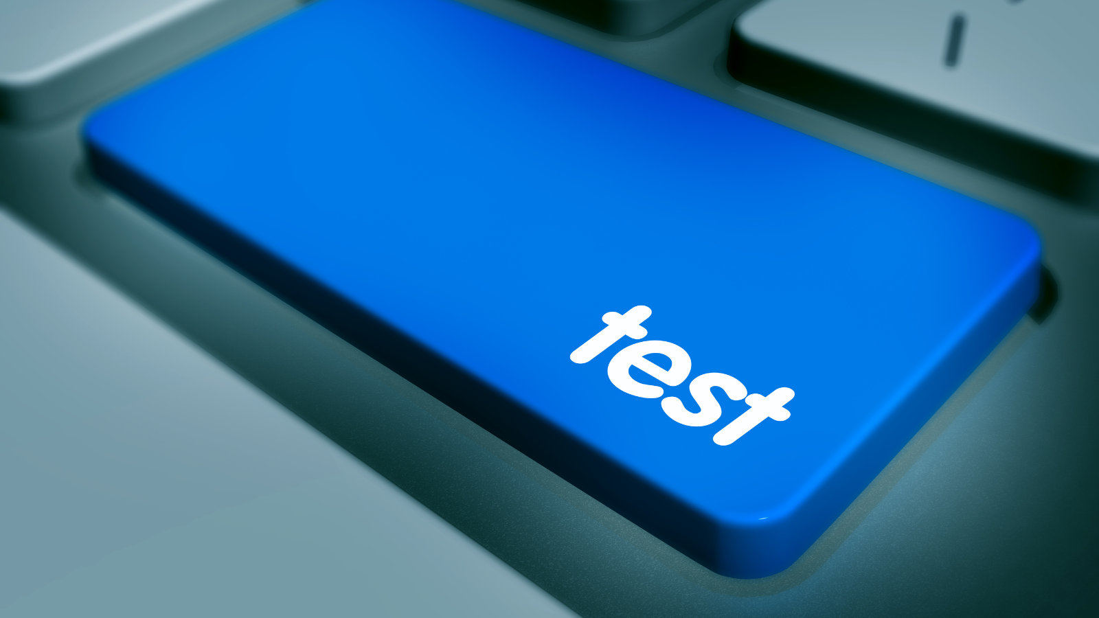 A close-up of a blue keyboard key labeled "test," symbolizing the concept of testing and experimentation. This image visually supports the blog topic "Optimize Your Cart with A/B Testing Using Supercart: Why You Should Start Today" by representing the action of running tests to improve eCommerce performance.