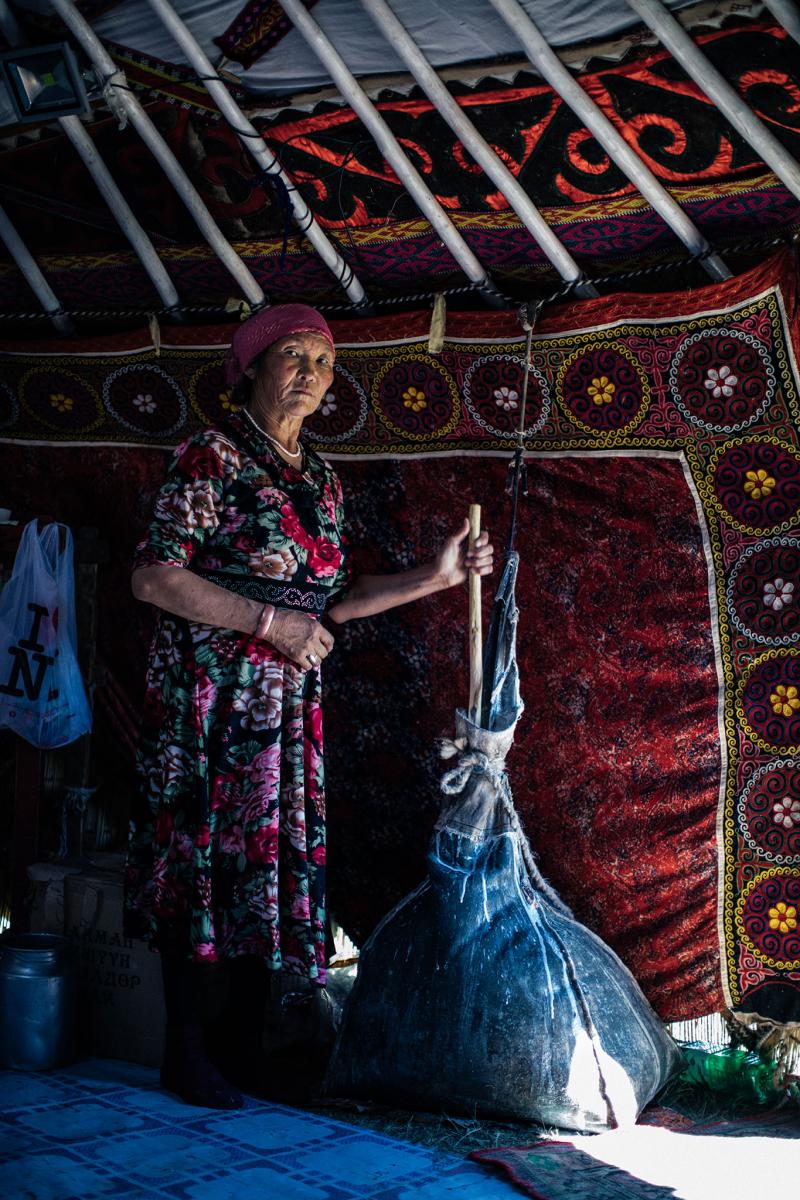 A Kazakh woman preparing kumis (fermented mare milk).