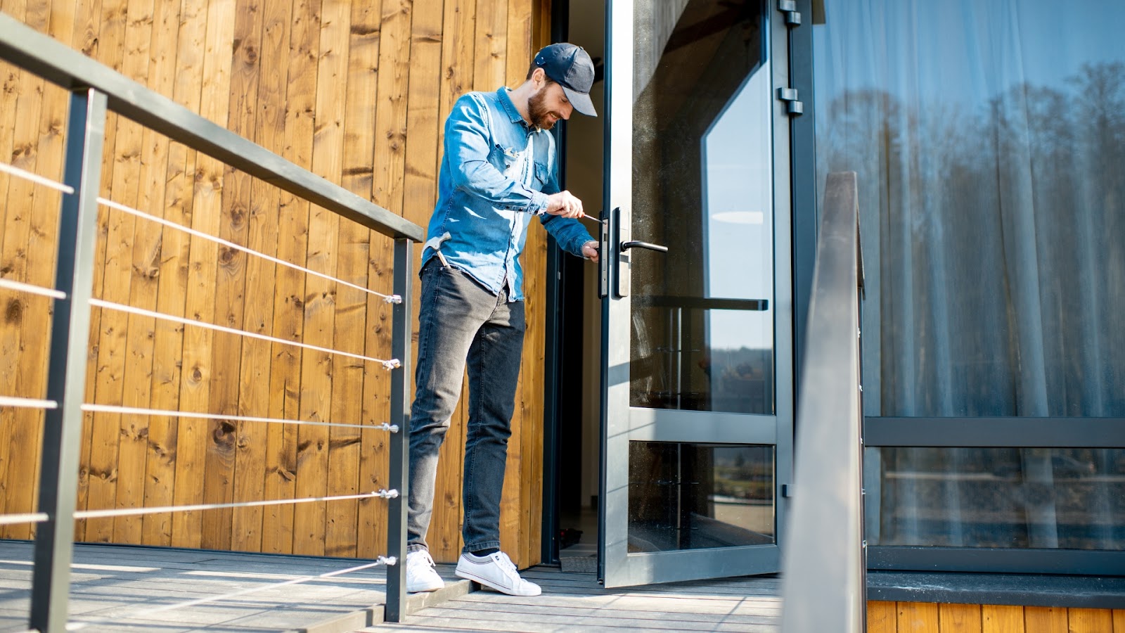 Locksmith working on a door lock, representing a reliable security lock service.