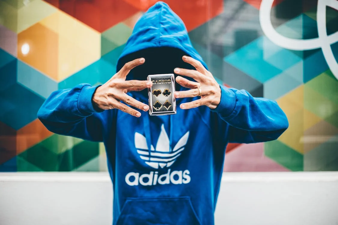 Photo by Kaique Rocha: https://www.pexels.com/photo/man-in-blue-adidas-hoodie-doing-magic-trick-48013/ 