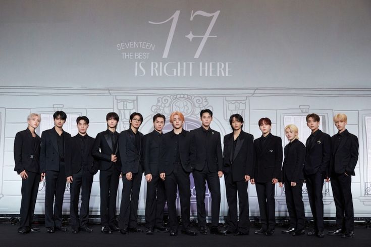 This  contain an image of SEVENTEEN standing next to each other in front of a large screen