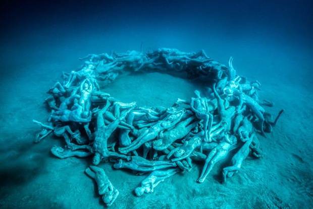 This may contain: an underwater sculpture is shown in the water