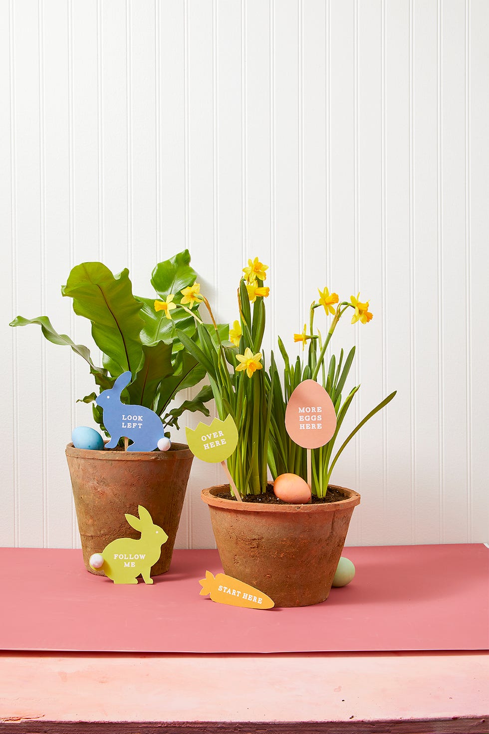 easter egg hunt bunny markers inside indoor plant pots