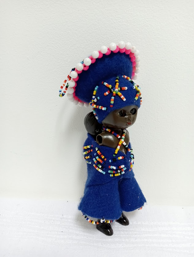 A small Zulu doll featuring intricate beading