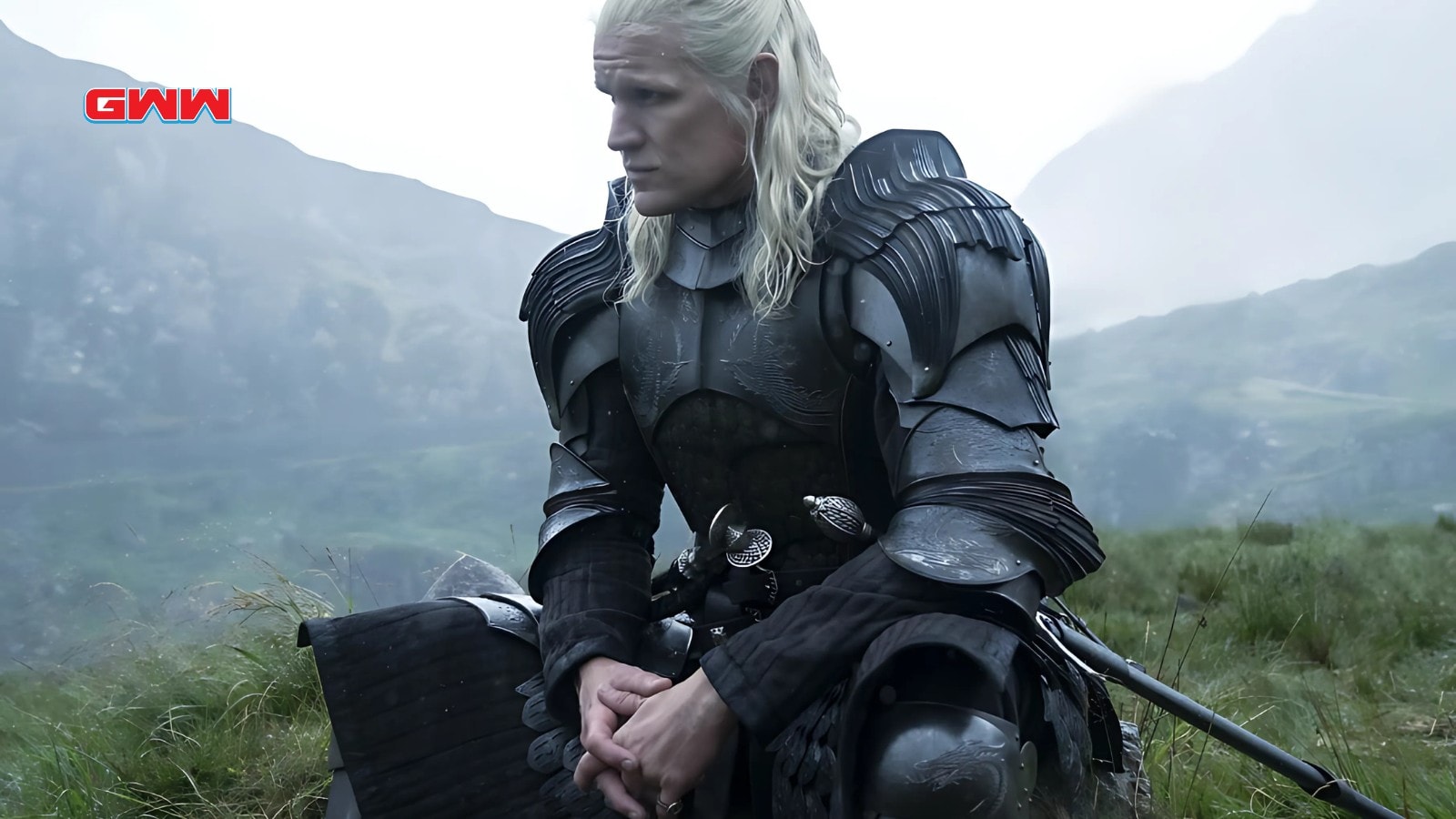 Matt Smith as Daemon Targaryen kneeling in dark armor on moor