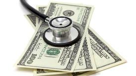 A stethoscope on top of money

Description automatically generated