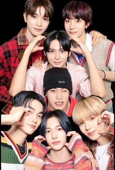 This contain an image of  RIIZE group   members  posing together for a photo with their hands on their ears