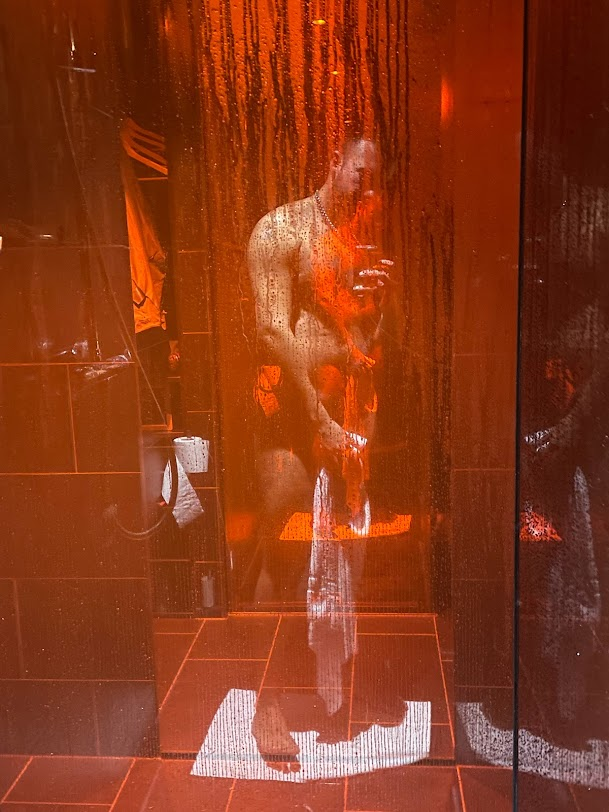 gay xxx onlyfans creator Phil holding a towel over his crotch showing off his naked body in the axel hotel bathroom in berlin, germany suite