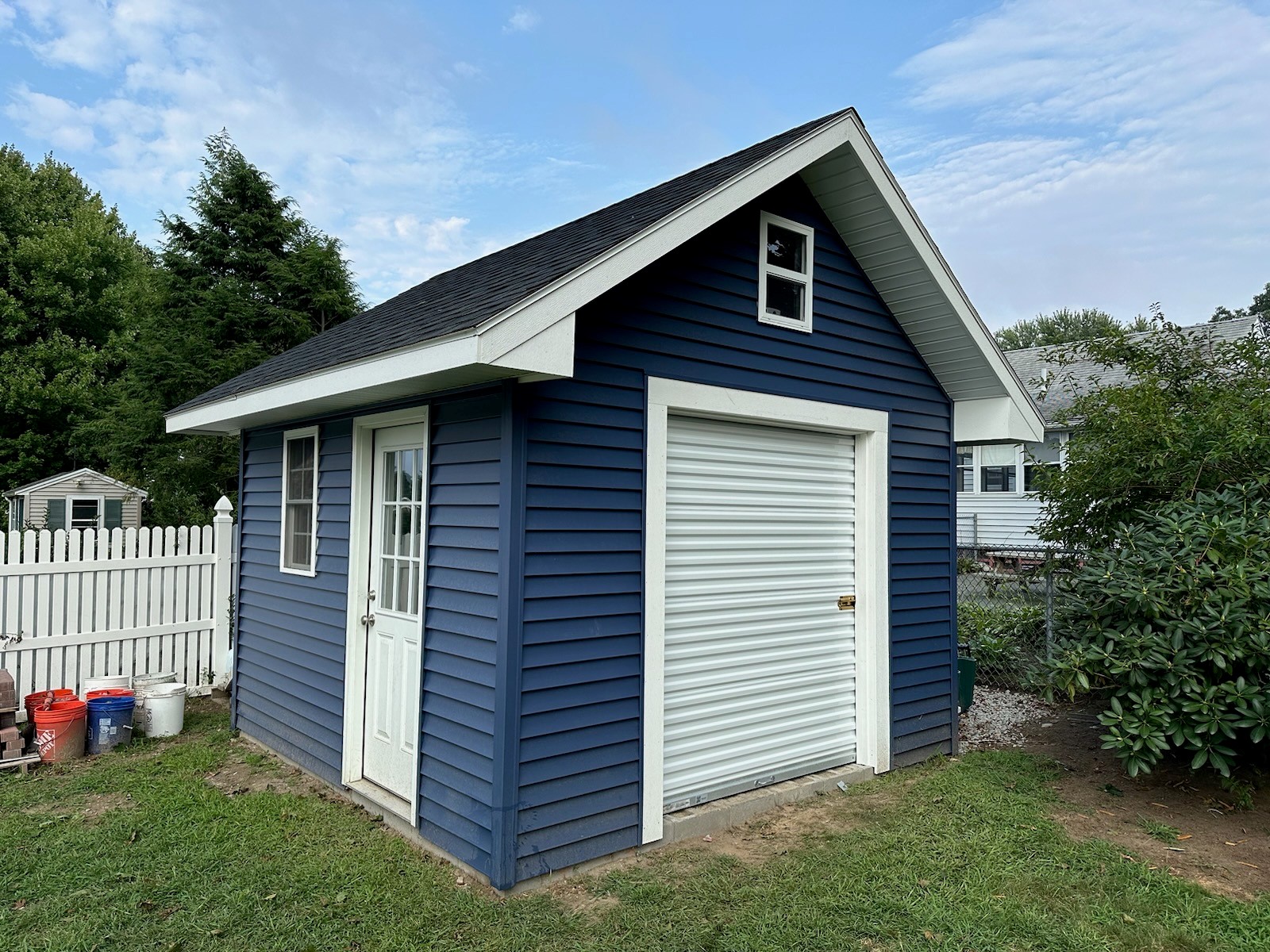 Janus Roll Up Doors on blue building