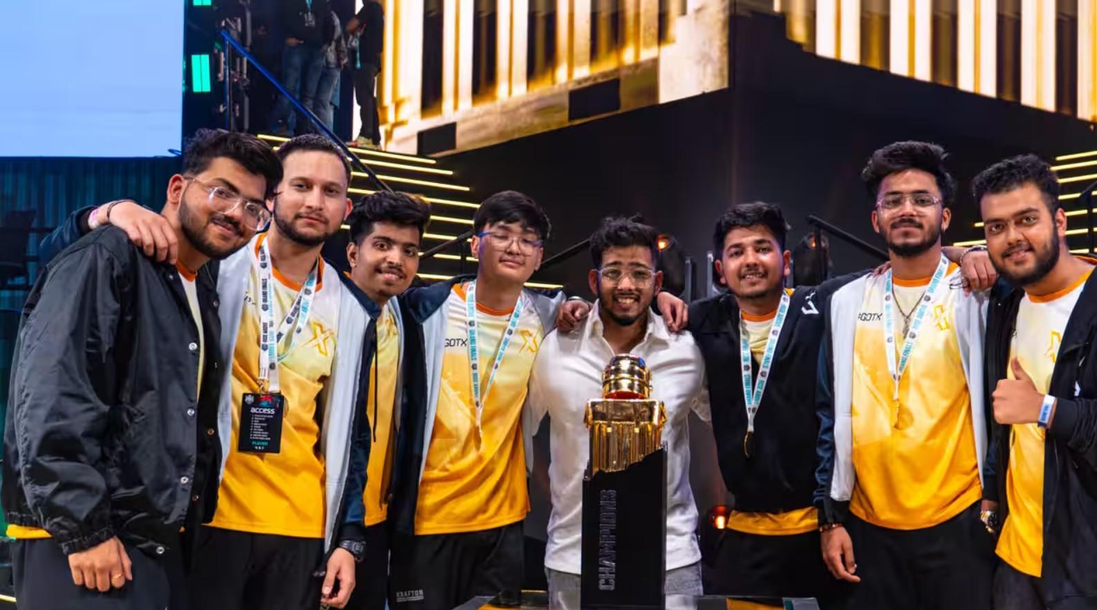 a picture of Team Xspark members with their trophy. 