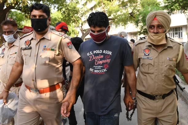 Police personnel escort to court, Hilal Ahmed Wagay accomplice of slain Riyaz Naikoo, the leader of the largest Kashmiri militant group Hizbul...