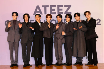 This contains an image of ATEEZ