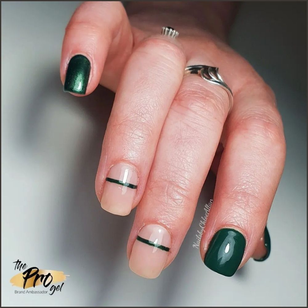 Close up of hands with Christmas Green Nails having  Minimalist Green Nails 