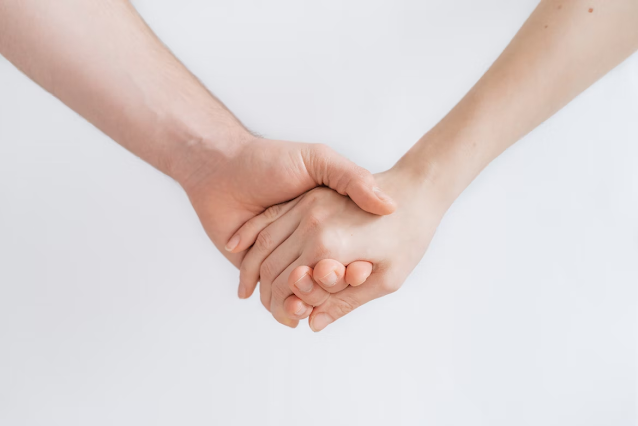 two hands holding hands supporting each other