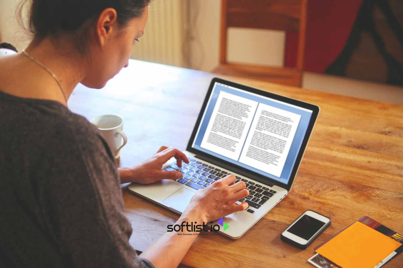 a woman typing to her laptop