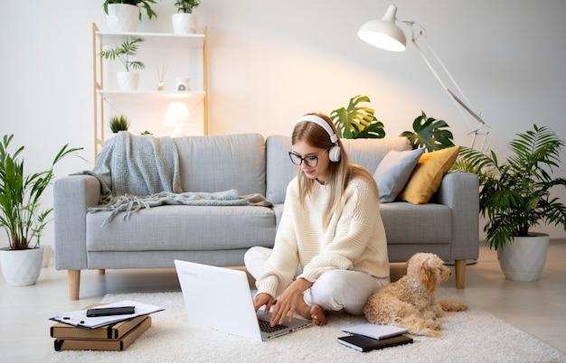 Full shot woman working at home