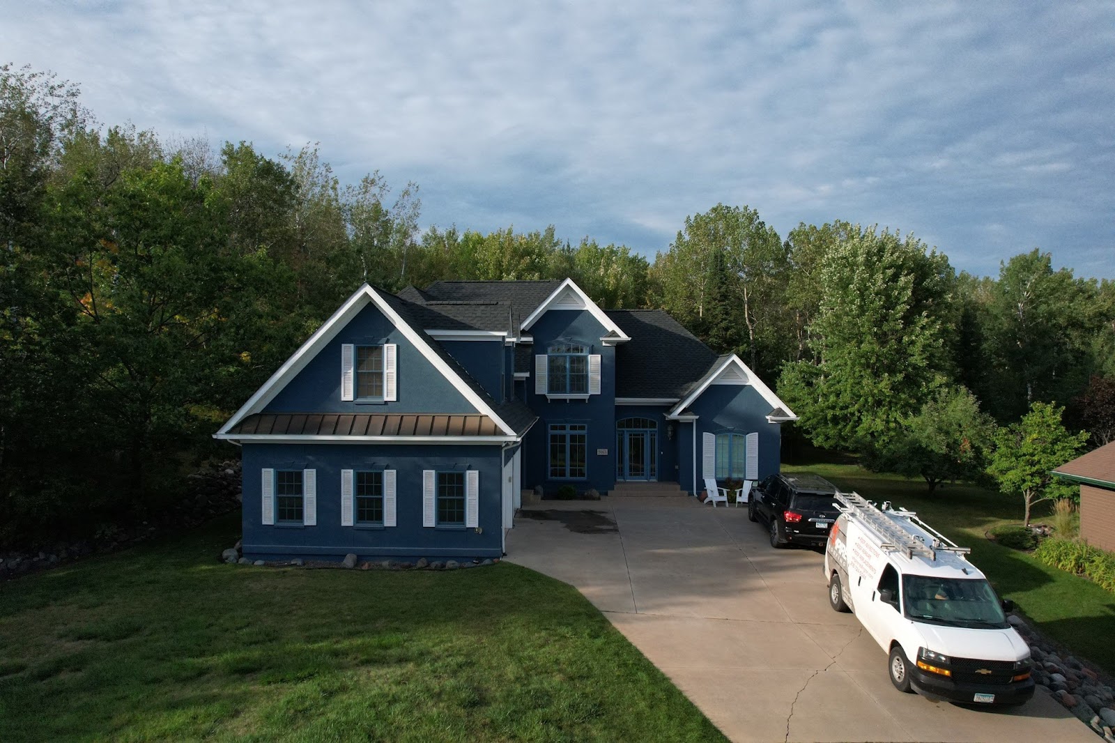 asphalt shingles installed by a roofing company, Chisholm, MN