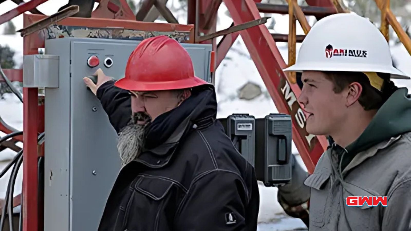 Gold Rush miner Dave Turin instructing a crew member at the control panel