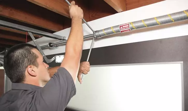 how to adjust a garage door spring