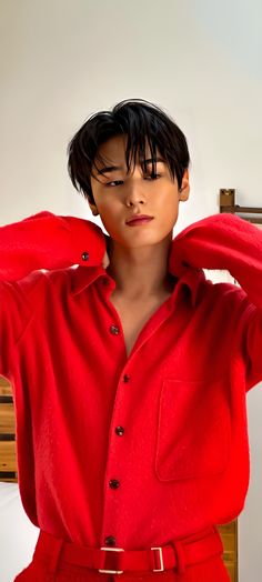 This contains an image of Juyeon  on red outfit 