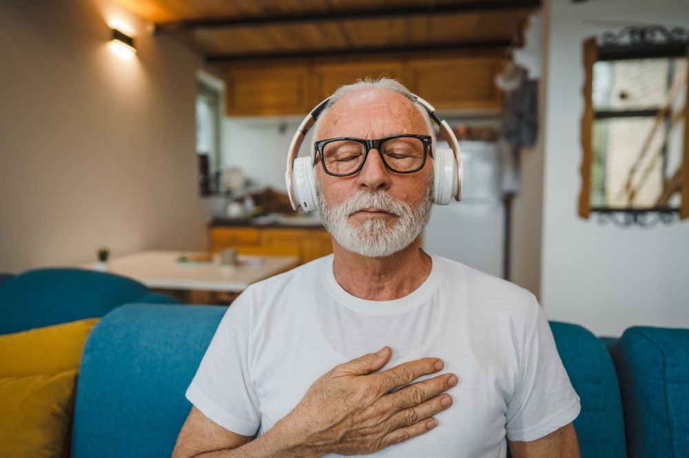 Man finding relief from anxiety and neuropathy through mindfulness mediation and stress relief.