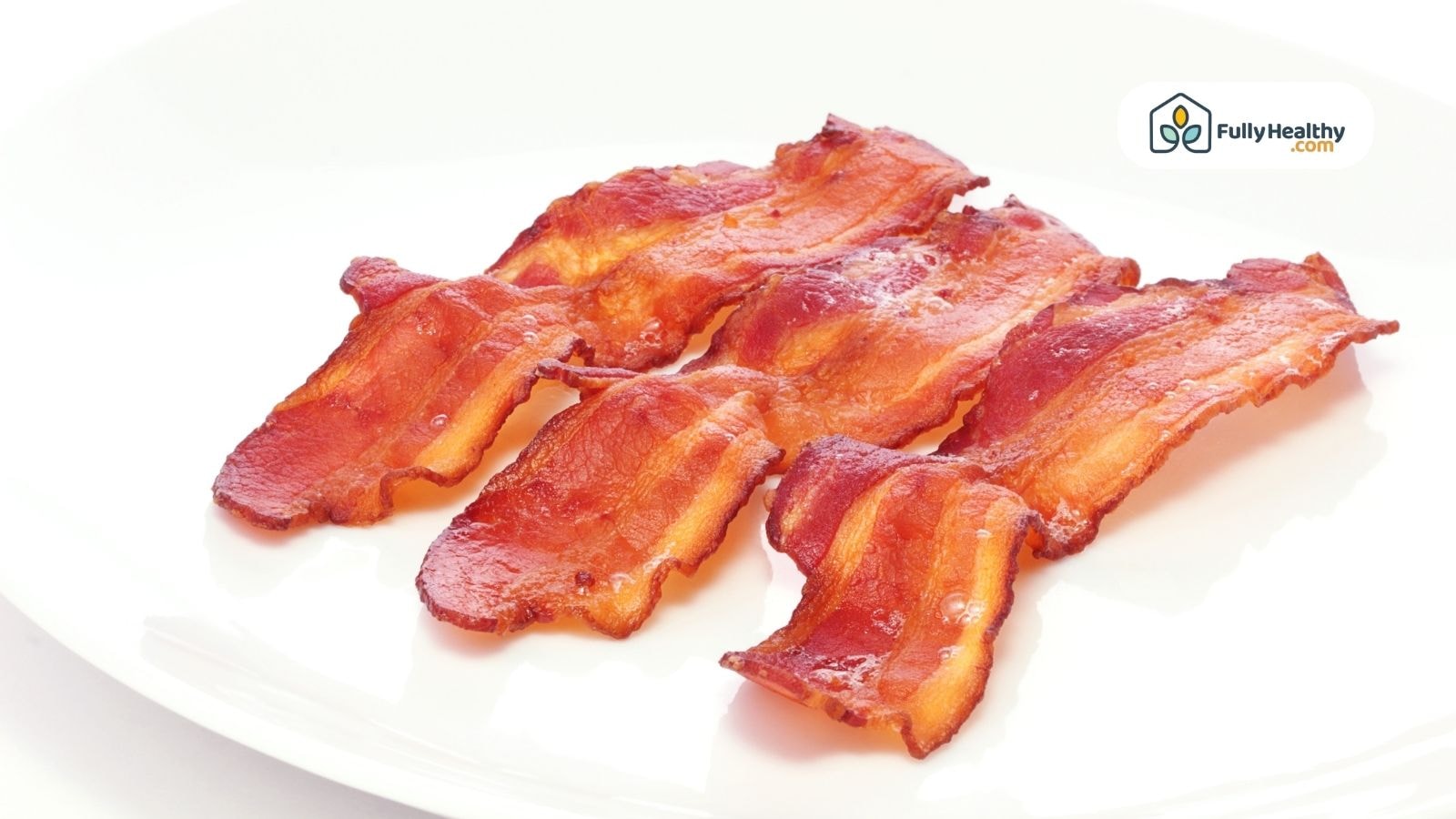 Crispy cooked bacon strips on white plate with FullyHealthy logo