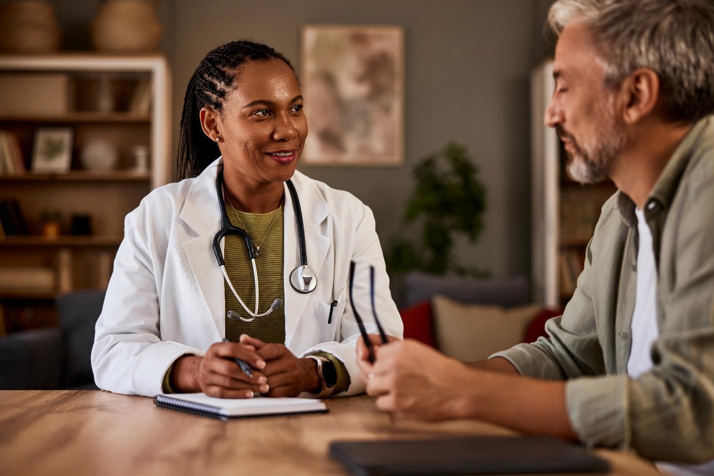 A doctor and a patient talking

AI-generated content may be incorrect.