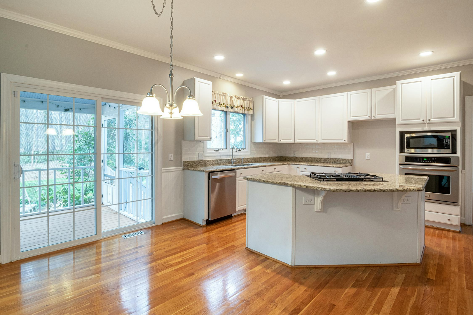 A well-lit, modern kitchen showcasing essential electrical upgrades every home kitchen needs, from a residential electrician's guide.